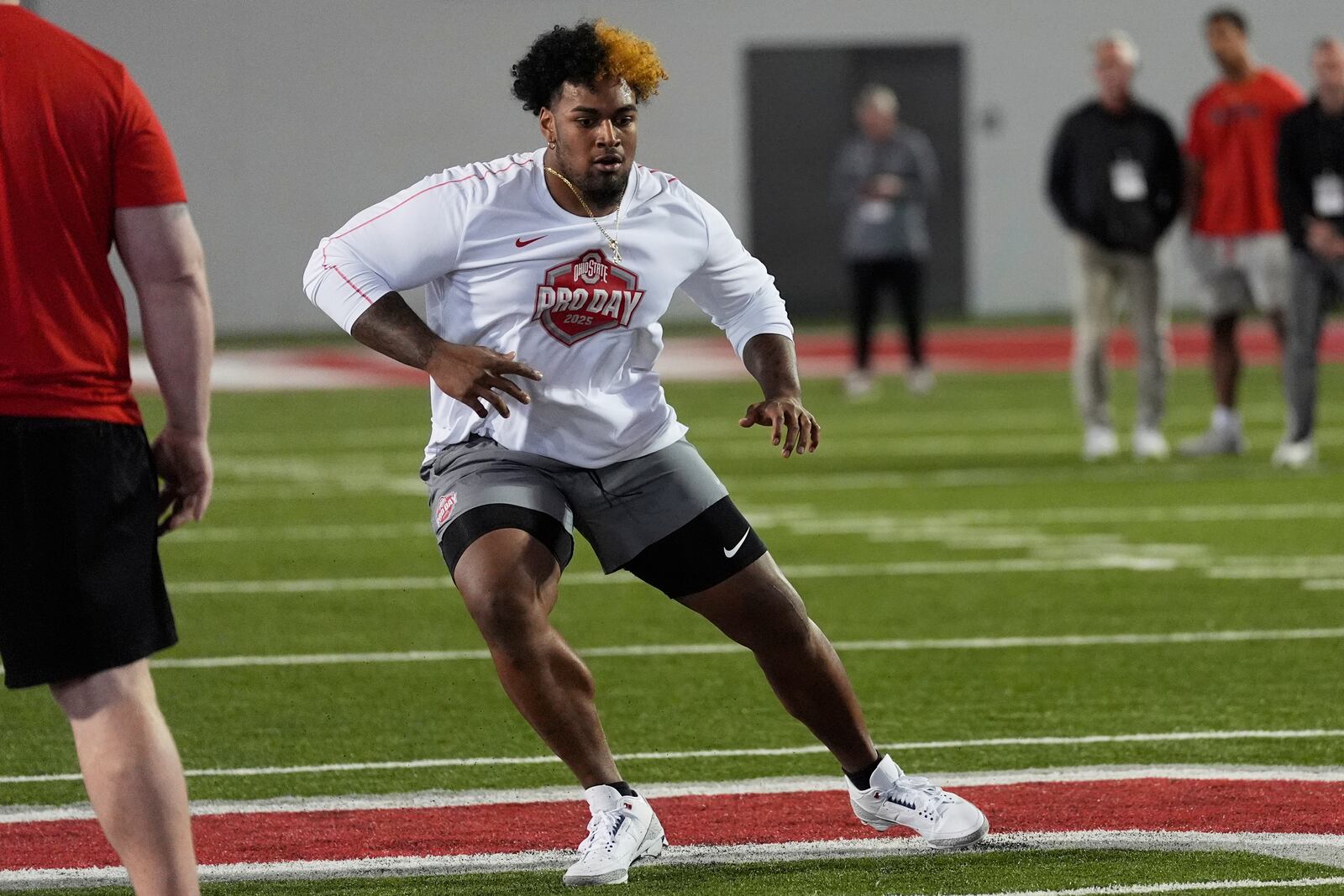 Ohio State offensive lineman Josh Simmons participates in a drill during the school's NFL football pro day, Wednesday, March 26, 2025, in Columbus, Ohio. (AP Photo/Sue Ogrocki)