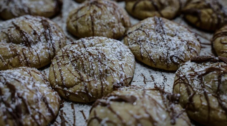 The Dayton Daily News Holiday Cookie Contest returned this year with area bakers submitting 32 of their very best recipes. A panel of judges selected the top three cookies. Pictured are Santa’s Snickers Surprises submitted by Linda Onkst of Greenville. JIM NOELKER/STAFF