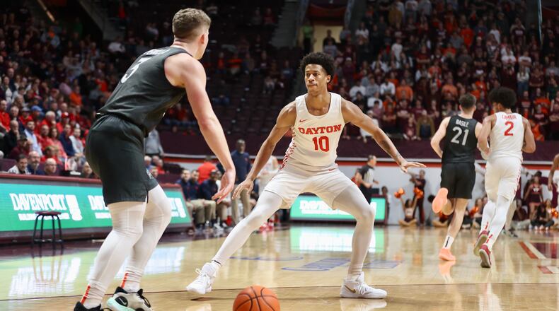Dayton's Kaleb Washington guards against Virginia Tech on Wednesday, Dec. 7, 2022, at Cassell Coliseum in Blacksburg, Va. David Jablonski/Staff