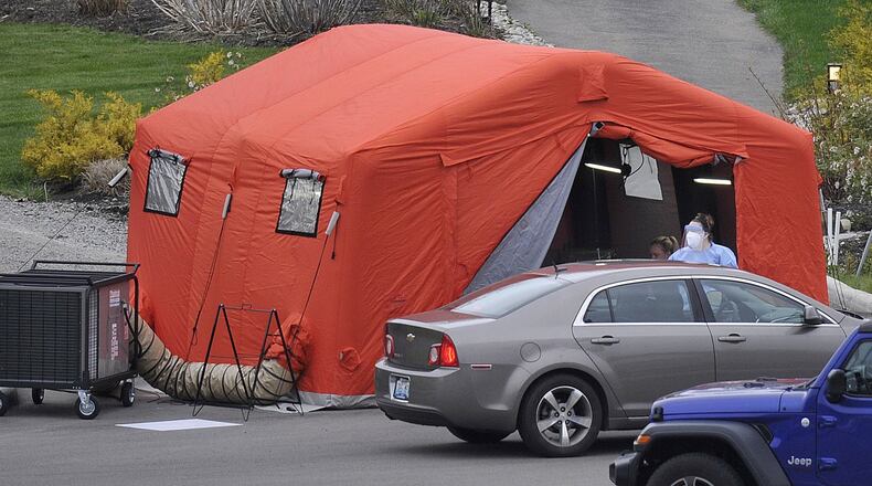 Kroger and Kettering Health Network partner to offer COVID-19 drive-through testing at the Kettering Medical Center in the Kettering College Parking lot, on Southern Blvd. Thursday. MARSHALL GORBYSTAFF