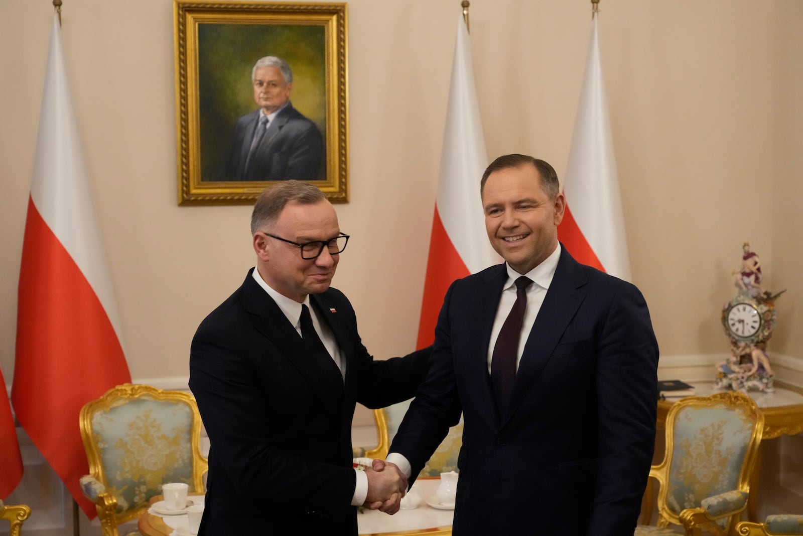 Poland's outgoing President Andrzej Duda, left, welcomes the President Elect Karol Nawrocki at the Presidential Palace in Warsaw, Poland, Tuesday, June 3, 2025. (AP Photo/Czarek Sokolowski)