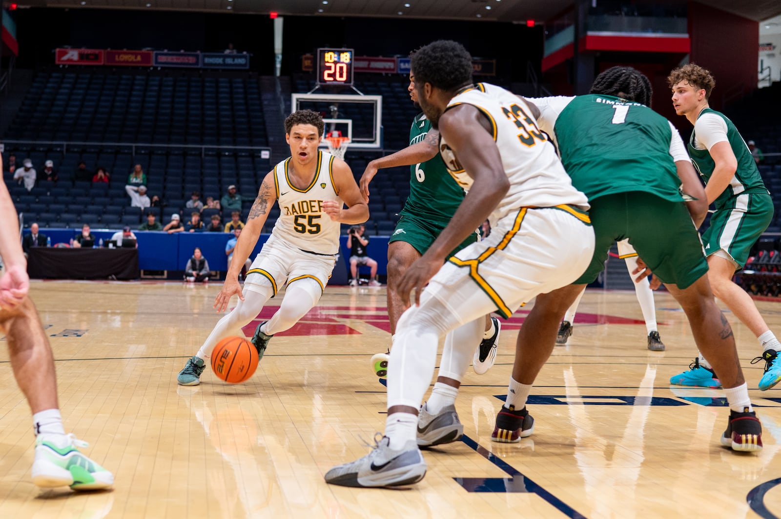 Wright State University guard Michael Cooper shoots dribbles past an Ohio University defender during their preseason game at UD Arena on Monday, Oct. 20 at UD Arena. The Raiders beat the Bobcats 63-57. WRIGHT STATE ATHLETICS / CONTRIBUTED PHOTO