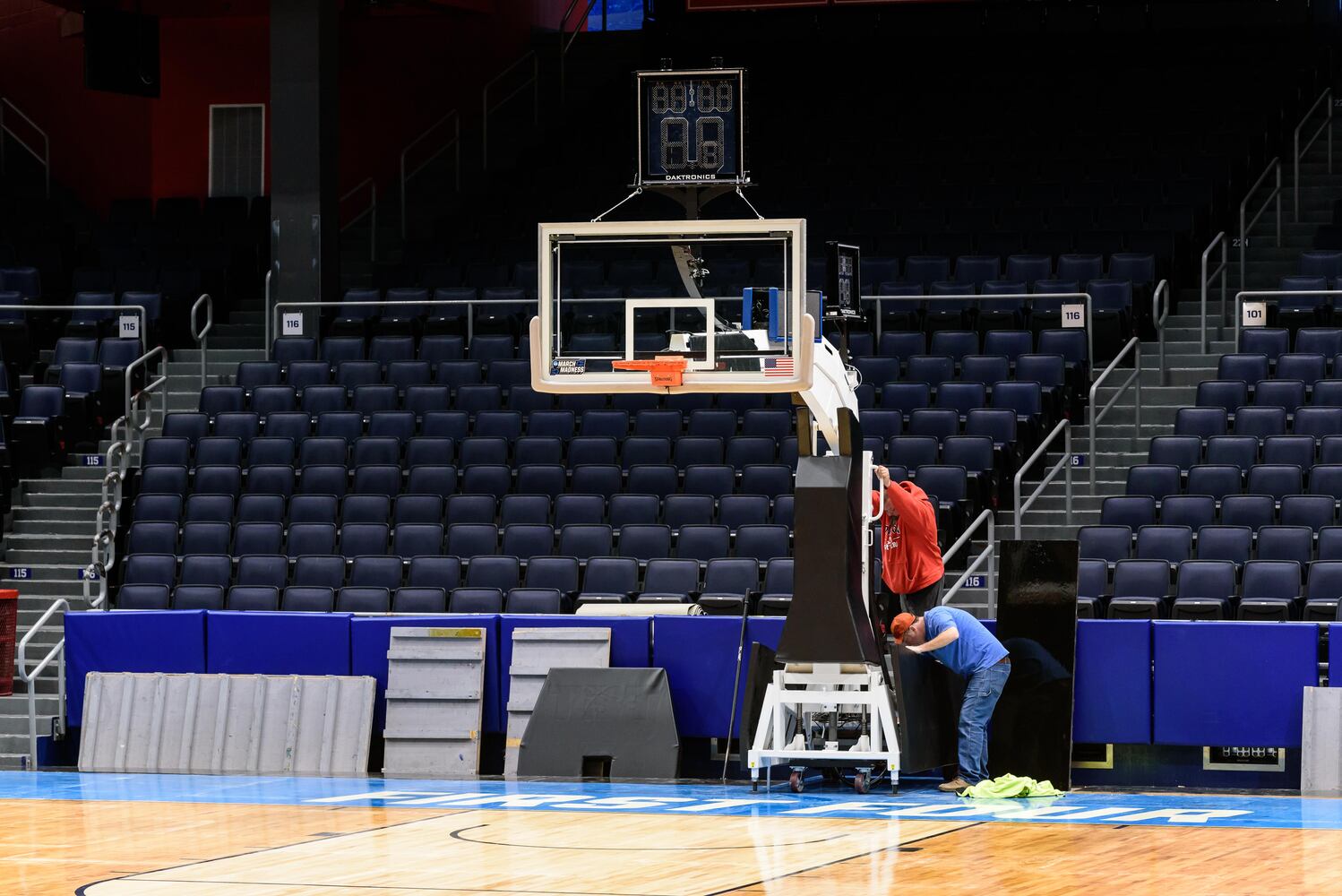 PHOTOS: NCAA First Four basketball court installation at UD Arena