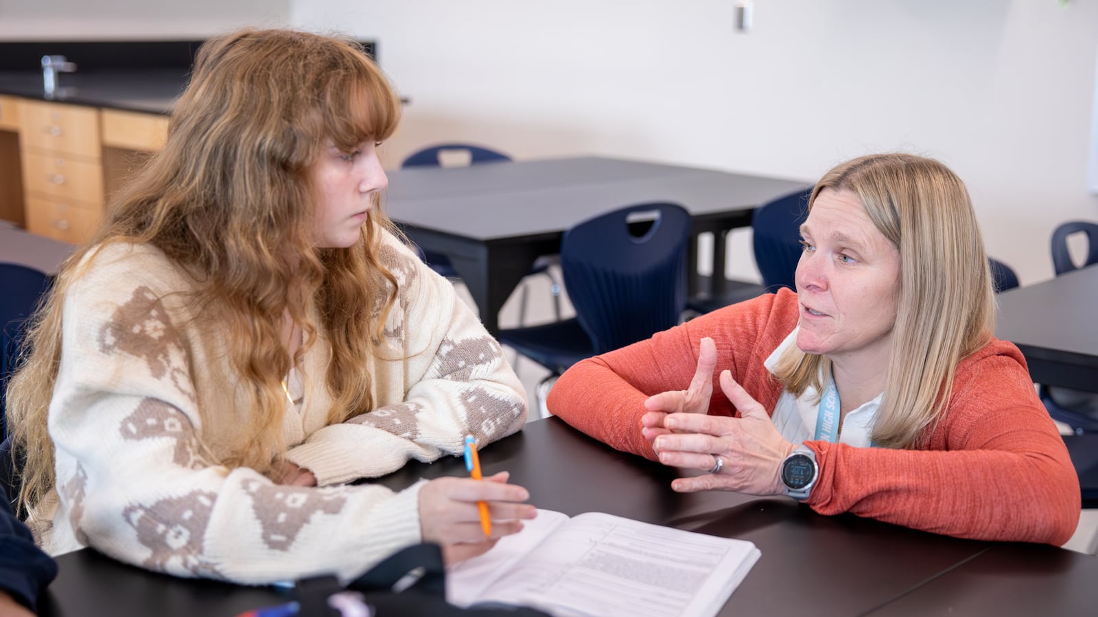 Amanda Spirk, a PLTW biomedical sciences teacher at Fairborn High School, talks to McKenzie Rowland during a class on Wednesday, Oct. 15. BRYANT BILLING / STAFF