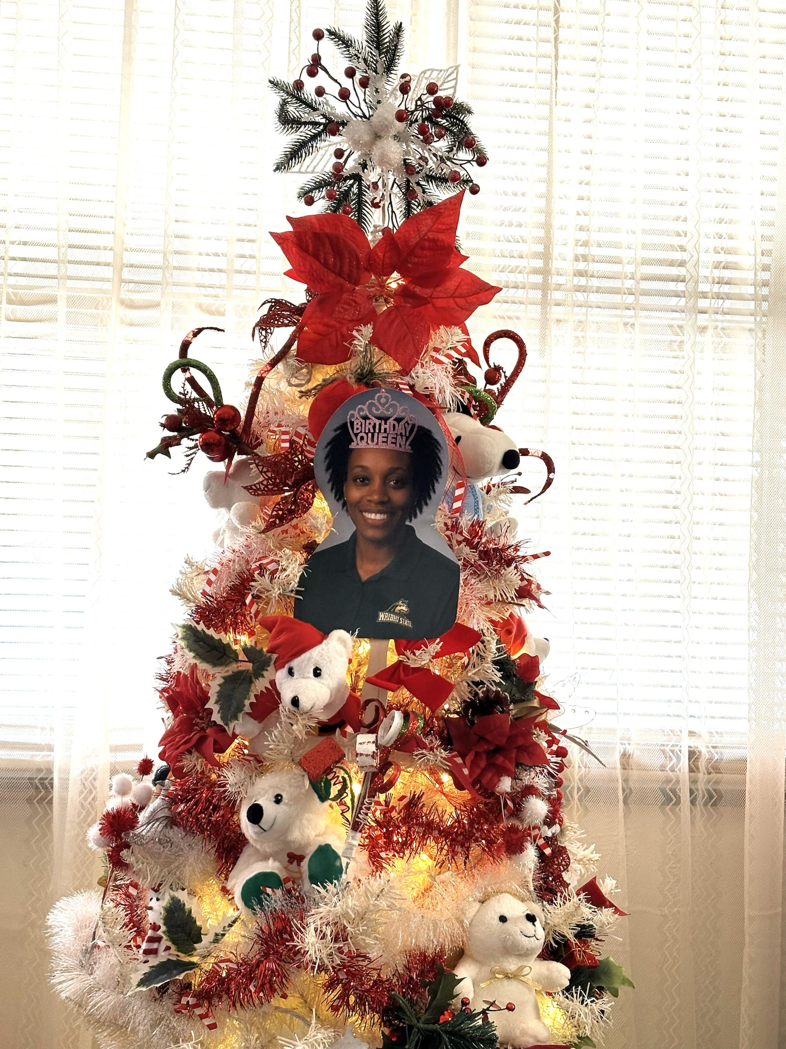 The Christmas tree Darlene Jones has up in the front room of her home in Springfield tells you all you need to know about the bond she has with her daughter LaShaunta', who is the athletic trainer for men’s basketball at Wright State and for 19 years prior served in various capacities at Central State from head athletic trainer to senior female administrator in athletics. Darelene’s tree features a large photo of her daughter wearing a birthday crown she sported when her mom and others  celebrated her December 16 birthday at Wright State with cupcakes and refreshments for Raiders’ athletes and their parents. TOM ARCHDEACON / CONTRIBUTED PHOTO