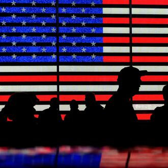 FILE - People stand in Times Square in New York, Aug. 9, 2024. (AP Photo/Pamela Smith, File)