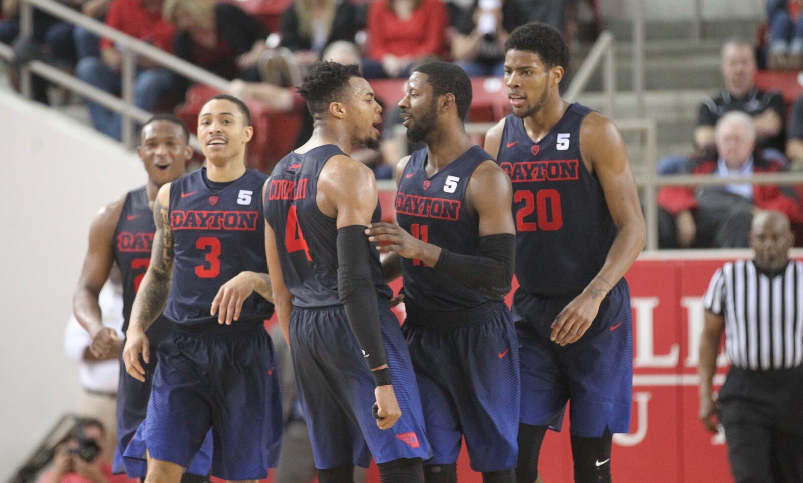 Dayton seniors (left to right) Kendall Pollard, Kyle Davis, Charles Cooke, Scoochie Smith and sophomore Xeyrius Williams, far right, react after the third 3-pointer by Smith in overtime against Davidson on Friday, Feb. 24, 2017, at Belk Arena in Davidson, N.C.