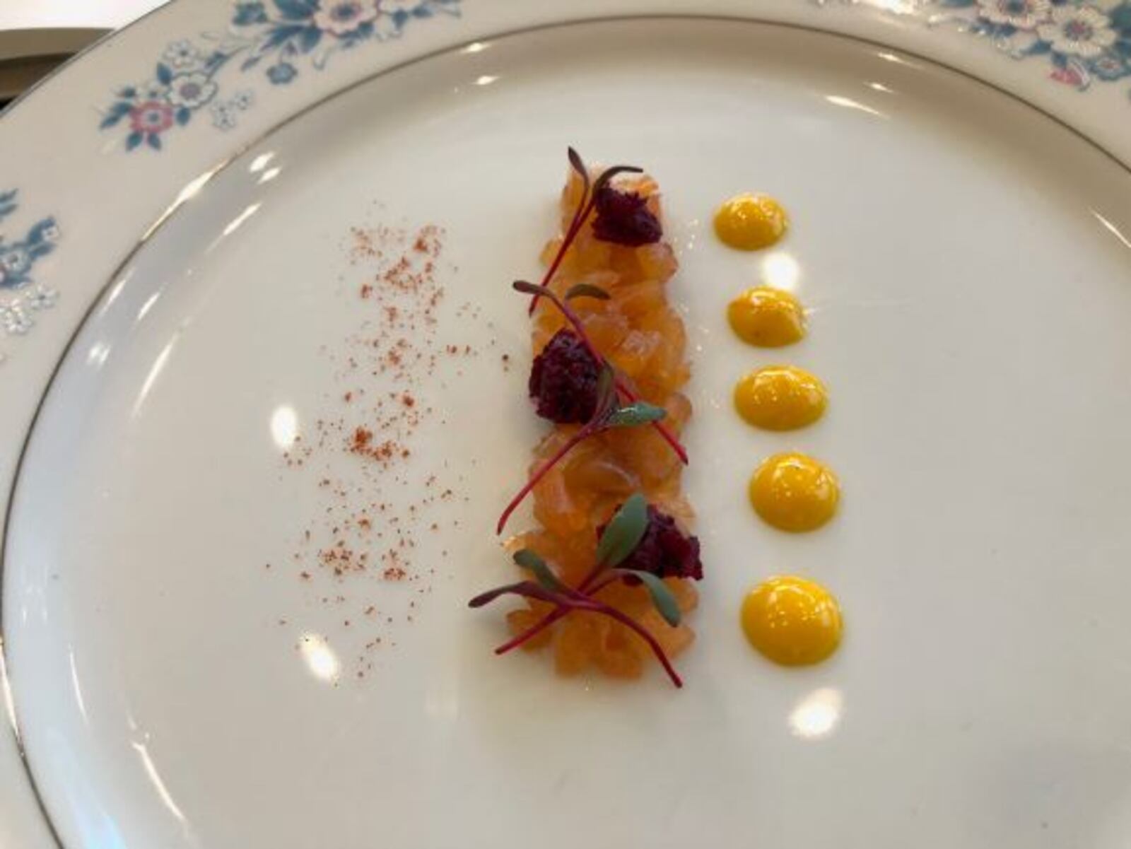 Brian Griffey's Green Peppercorn-Cured and Smoked Skuna Bay Salmon with Beer-Black Truffle Tapenade, Saffron Aioli and Micro-Beet Greens. MARK FISHER/STAFF
