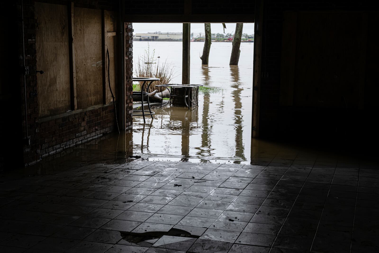 Floodwaters enter a garage in a home on the banks of the Ohio River on Saturday, April 5, 2025, in Louisville, Ky. (AP Photo/Jon Cherry)