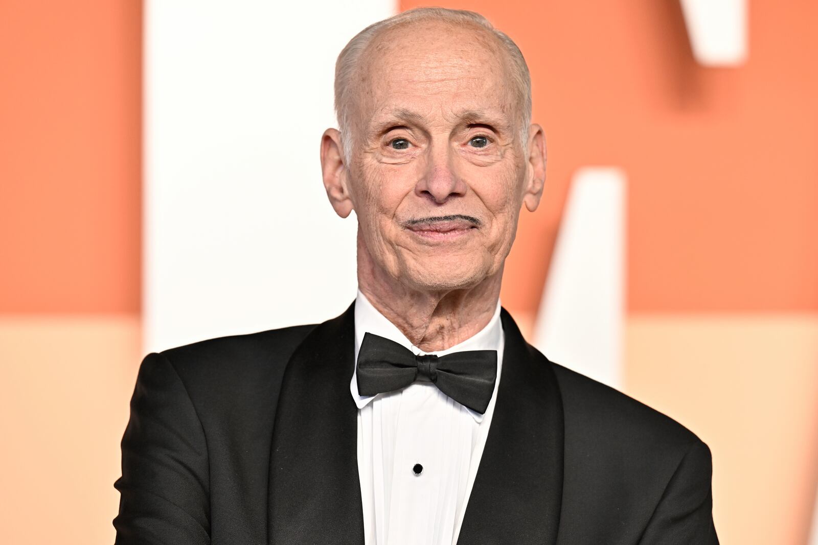 John Waters arrives at the Vanity Fair Oscar Party on Sunday, March 2, 2025, at the Wallis Annenberg Center for the Performing Arts in Beverly Hills, Calif. (Photo by Evan Agostini/Invision/AP)