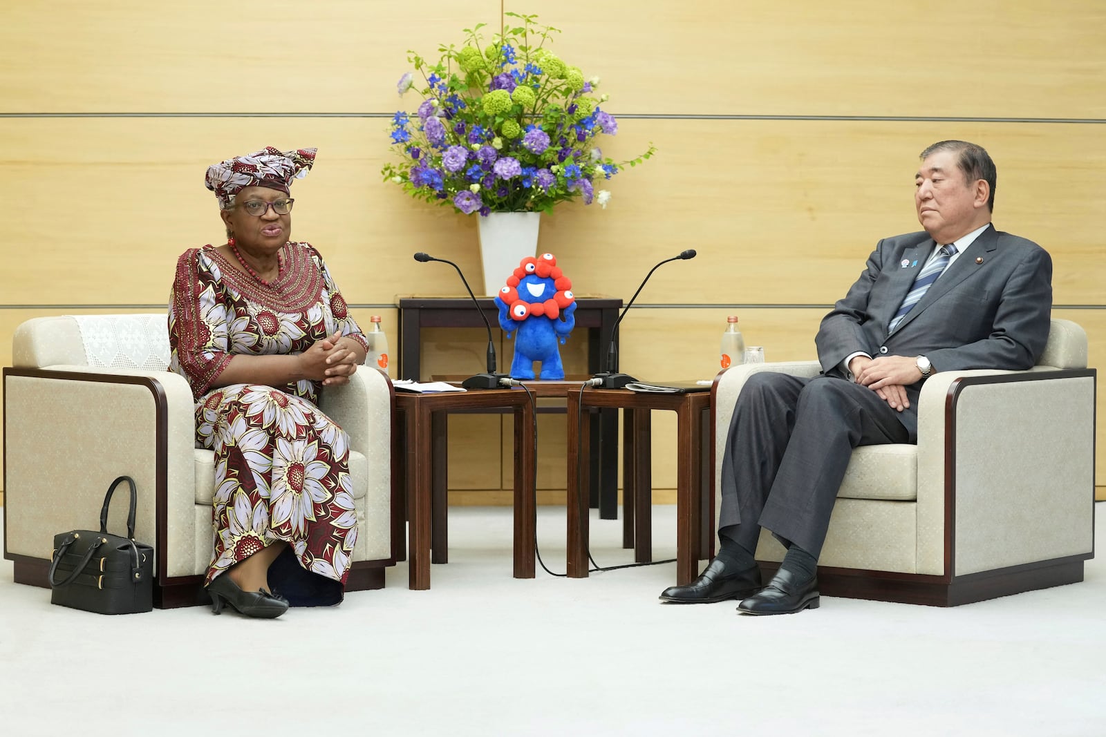 World Trade Organization (WTO) Director-General Ngozi Okonjo-Iweala, left, meets with Japan's Prime Minister Shigeru Ishiba at the latter's office in Tokyo Tuesday, May 13, 2025. (Kazuhiro Nogi/Pool Photo via AP)