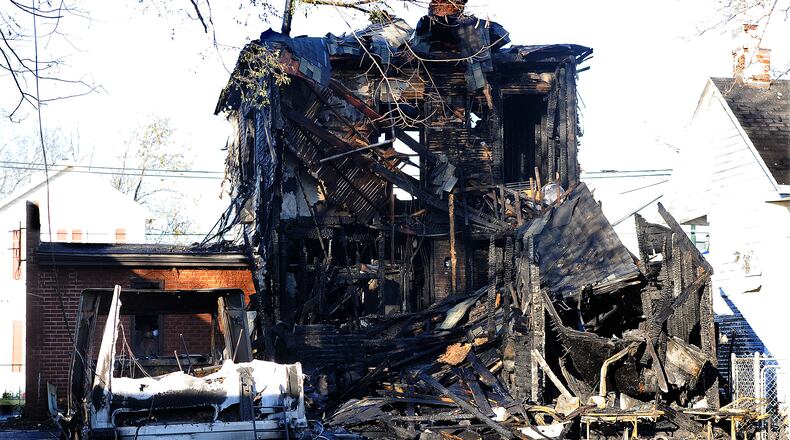 Crews responded to a house fire in the 500 block of Troy Street Wednesday night Nov. 9, 2022. The fire spread to two different houses. MARSHALL GORBY\STAFF
