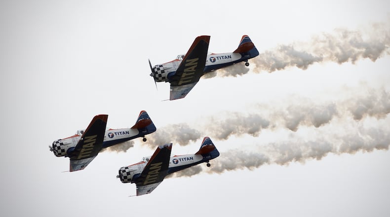 The Titan Aerobatic Team flies in formation at the Dayton Air Show on Sunday, June 23, 2024. MARSHALL GORBY / STAFF