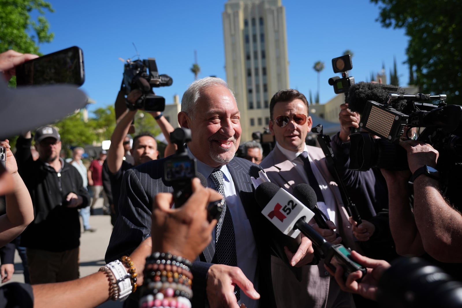 Attorney Mark Geragos, a lawyer for Erik and Lyle Menendez, who were convicted of killing their parents in 1989, speaks to reporters as he arrives to court Friday, May 9, 2025, in Los Angeles. (AP Photo/Jae C. Hong)