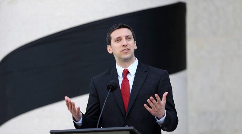 FILE - In this May 14, 2015, file photo, then-Cincinnati Councilman P.G. Sittenfeld speaks outside of the Ohio Statehouse, in Columbus, Ohio. The former Cincinnati councilman,'s upcoming bribery trial is set for later this month. (Courtney Hergesheimer/The Columbus Dispatch via AP, File)