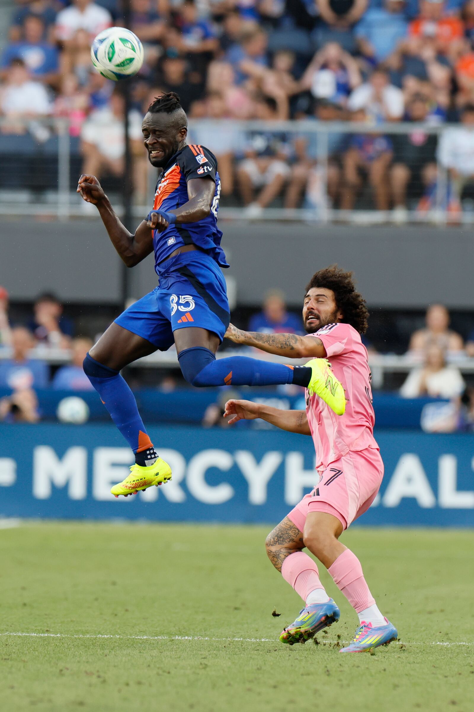 FC Cincinnati's Kei Kamara, left, heads the ball away from Inter Miami's Maximiliano Falcon during the first half of an MLS soccer match, Wednesday, July 16, 2025, in Cincinnati. (AP Photo/Jay LaPrete)