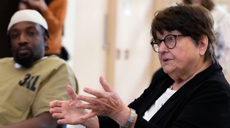 Sister Helen Prejean, right, talks during a book club as detainee listens at Department Of Corrections Division 11 in Chicago, Monday, April 22, 2024. Prejean will appear Tuesday, April 8 at the Victoria Theatre in Dayton. (AP Photo/Nam Y. Huh)