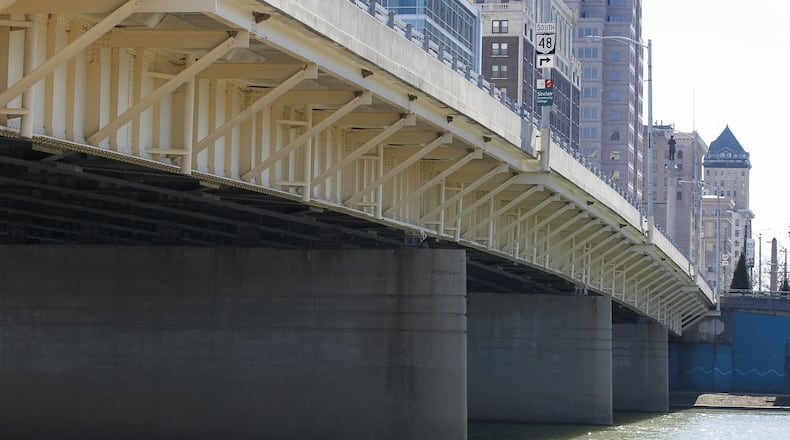 Renovation of the Main Street bridge on Ohio 48 over the Great Miami River in downtown Dayton will disrupt traffic and Greater Dayton Regional Transit Authority bus routes through fall 2019. CHRIS STEWART / STAFF