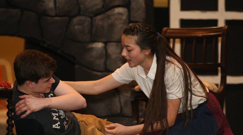 David Shockey (Beast) and Emi Ford (Belle) rehearse a tender moment in Children s Performing Arts of Miamisburg’s production of Disney’s Beauty and the Beast, slated for May 5-13 at Memorial Auditorium. CONTRIBUTED