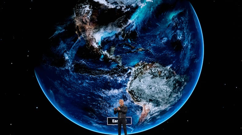 NVIDIA CEO Jensen Huang speaks on how AI infrastructure and AI factories that generate intelligence at scale are powering a new industrial revolution, at Washington Convention Center, Tuesday, Oct. 28, 2025, in Washington. (AP Photo/Manuel Balce Ceneta)