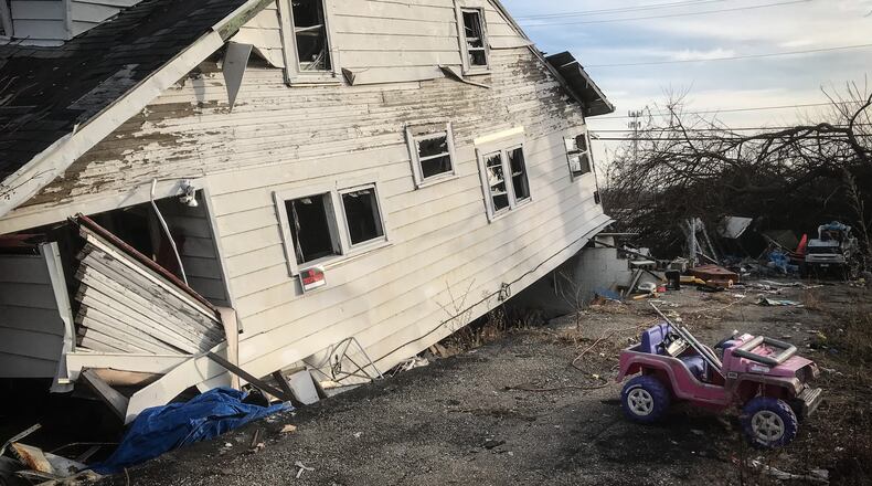 A house on Maplegrove Avenue in Harrison Twp. was knocked off its foundation during the Memorial Day tornados in 2019. The condemned house still stands along with memories of the family that once lived here. JIM NOELKER/STAFF