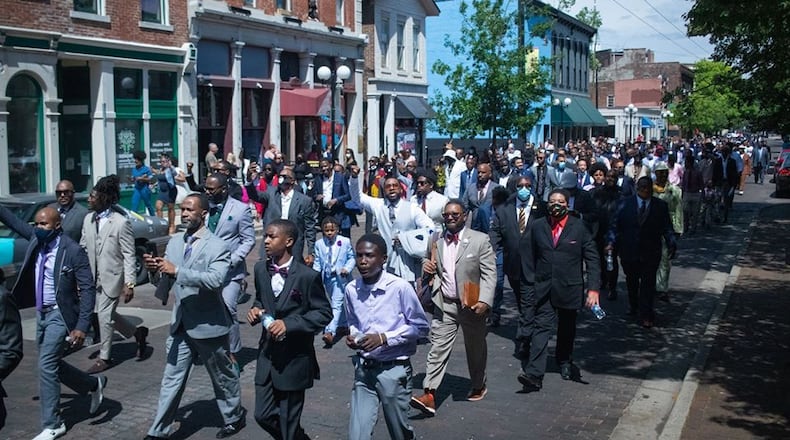 More than 300 black men marched through the streets of downtown and the Oregon District Sunday, June 14 as part of the Suits in Solidarity, an event organized by Brandon White, the owner of White House Event Center, 101 E. 2nd St, Dayton. He said he hopes it becomes an annual tradition.