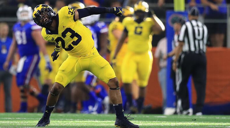 ARLINGTON, TX - SEPTEMBER 02: Tyree Kinnel #23 of the Michigan Wolverines celebrates a touchdown fumble recovery in the fourth quarter against the Florida Gators at AT&T Stadium on September 2, 2017 in Arlington, Texas. (Photo by Ronald Martinez/Getty Images)