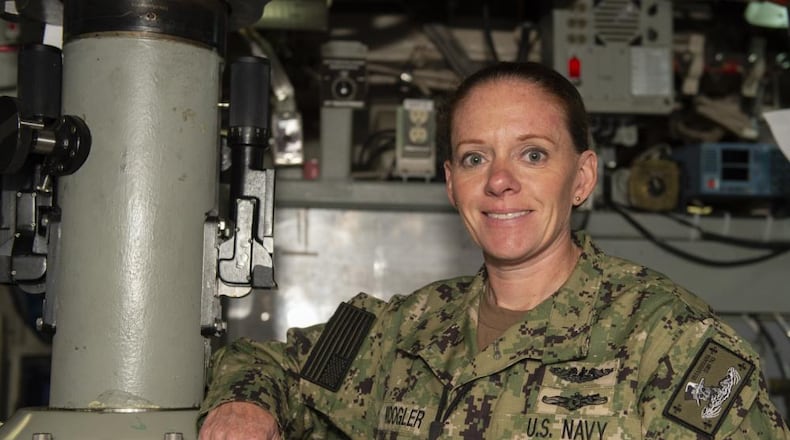 U.S. Navy Master Chief Information Systems Technician Angela Koogler poses for an environmental portrait aboard the Ohio-class ballistic missile submarine USS Louisiana. Koogler is the Navy’s first female chief of the boat. (U.S. Navy photo by Mass Communication Specialist 1st Class Brian G. Reynolds)