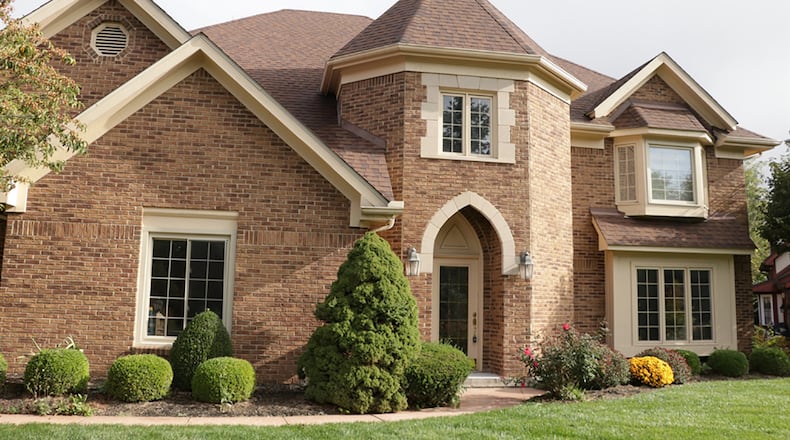 The 2-story brick house, which has about 3,460 sq. ft. of living space, includes 4 bedrooms and an upstairs recreation room with wet bar and a back staircase to the main-level family room. CONTRIBUTED PHOTO BY KATHY TYLER