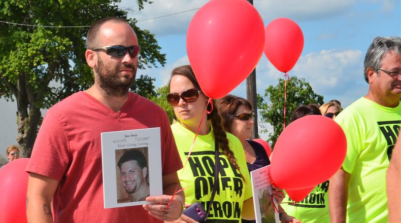 Participants in the 2016 Miami County Hope Over Heroin event participate in a march of remembrance. CONTRIBUTED