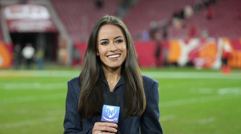 FILE - NFL sidelines reporter Kaylee Hartung reports to the camera following an NFL football game between the Atlanta Falcons and the Tampa Bay Buccaneers, Thursday, Dec 11, 2025, in Tampa, Fla. (AP Photo/Peter Joneleit, file)