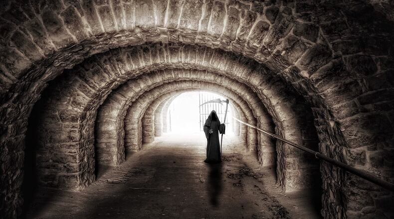 Stock photo of the Grim Reaper. A Florida lawyer spent Friday, May 1, 2020, dressed as the Grim Reaper to protest crowds returning to Florida Panhandle beaches following temporary coronavirus closures.