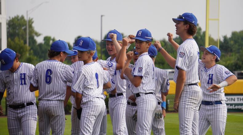 West Side Little League players break a huddle before their Great Lakes Region game against Kentucky on Saturday at the Little League Central Region Complex in Whitestown, Indiana. West Side won 7-0. CHRIS VOGT / CONTRIBUTED