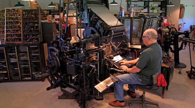 Volunteer Dennis Behm works in the Carillon Historical Park Print Shop. CONTRIBUTED/SKIP PETERSON