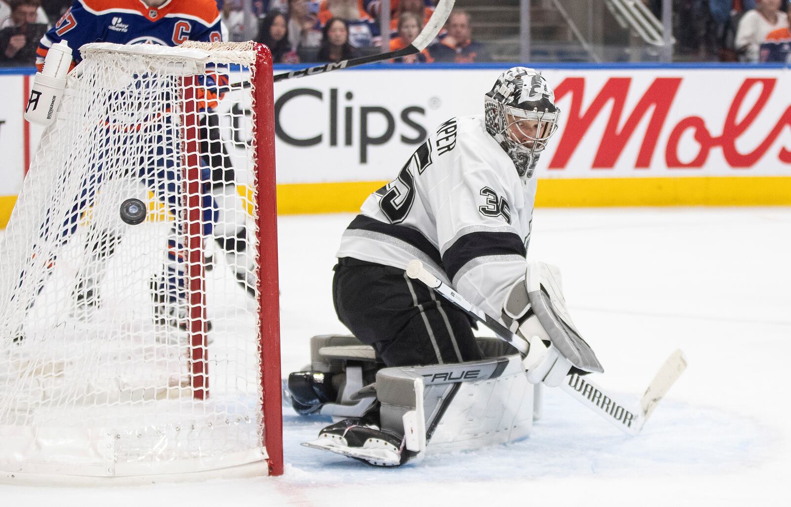 Los Angeles Kings goalie Darcy Kuemper (35) makes a save against the Edmonton Oilers during the second period of an NHL hockey game in Edmonton, Alberta, Thursday, May 1, 2025. (Jason Franson/The Canadian Press via AP)