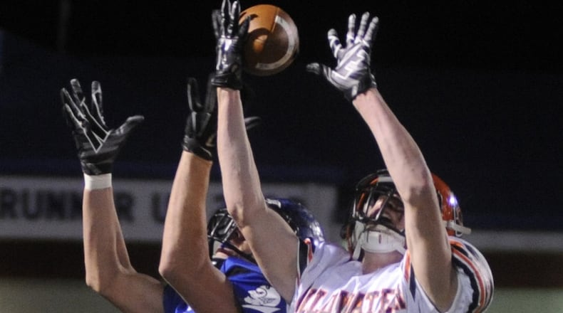 Neal Muhlenkamp of Coldwater (right) was chosen a Division V first-team All-Ohio receiver. MARC PENDLETON / STAFF