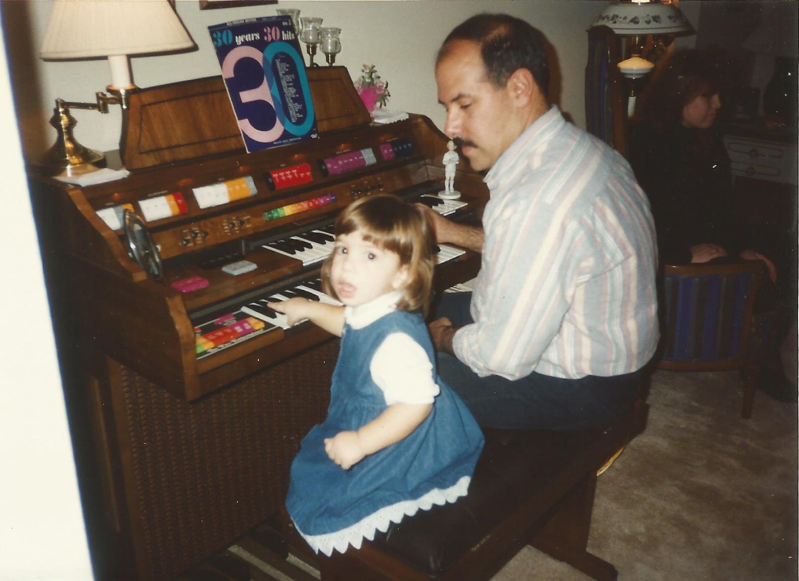 Emily Scovil at age 3 (Left) with her dad Steve, who worked at Requarth Lumber and brought his daughter to work with him. This inspired her to build a career in the construction industry. CONTRIBUTED