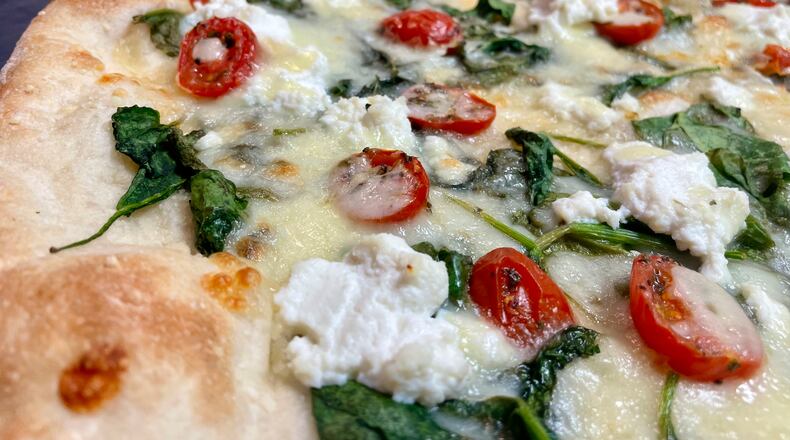 Troni’s Pizza & Pasta is open at 40 N Main St. in the lobby of the Stratacache Tower in downtown Dayton. NATALIE JONES/STAFF