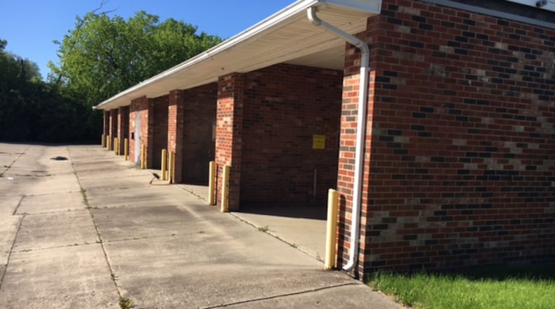 The city of West Carrollton is seeking federal funds to demolish and restore about a third of an acre it owns at 518 E. Dixie Drive. NICK BLIZZARD/STAFF