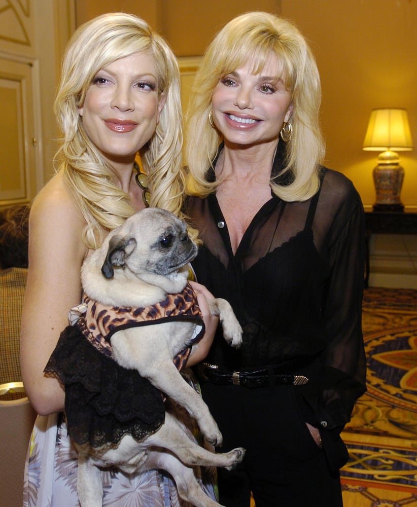 Actress Tori Spelling poses with dog Mimi LaRue and actress Loni Anderson.