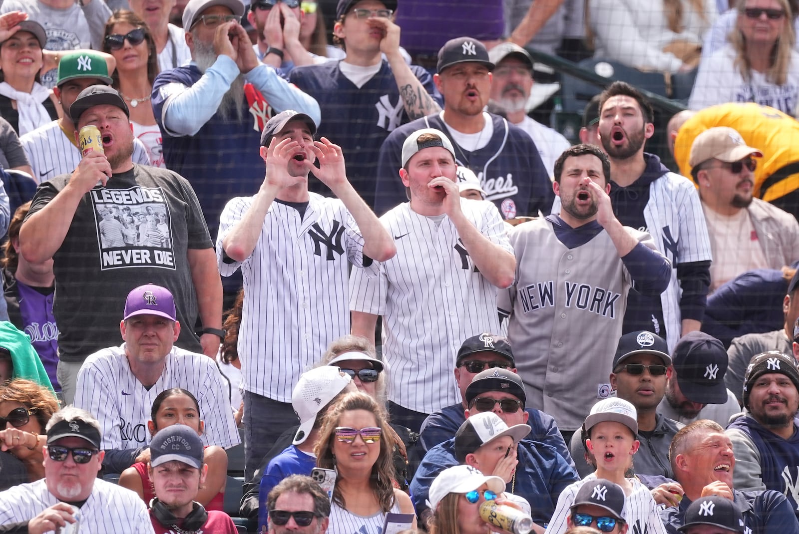 Fans boo when New York Yankees' Aaron Judge is given an intentional walk in the fifth inning of a baseball game against the Colorado Rockies, Saturday, May 24, 2025, in Denver. (AP Photo/David Zalubowski)
