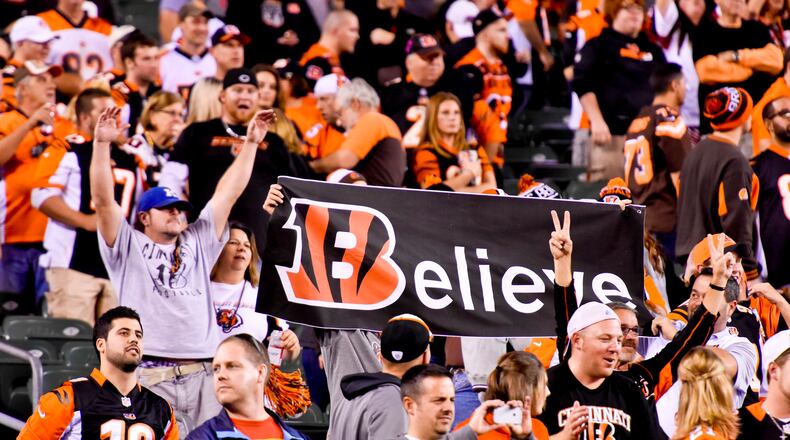 Cincinnati Bengals fans cheer after they beat the Cleveland Browns 31-10 Thursday, Nov. 5 at Paul Brown Stadium in Cincinnati. The Bengals are now 8-0 on the season.  NICK GRAHAM/STAFF
