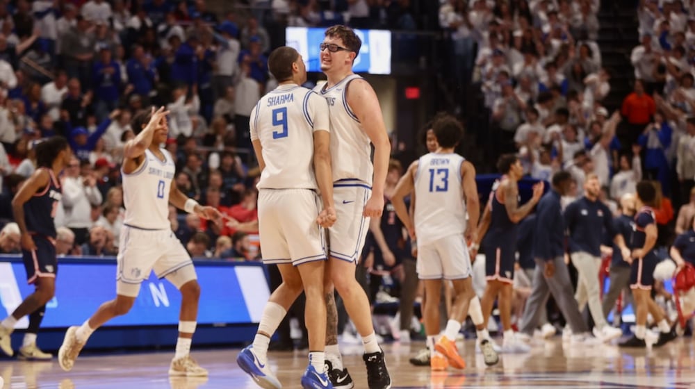Ishan Sharma, left, and Robbie Avila, right, of Saint Louis, celebrate after a basket against Dayton in the first half on Friday, Jan. 30, 2026, at Chaifetz Arena in St. Louis, Mo. David Jablonski/Staff