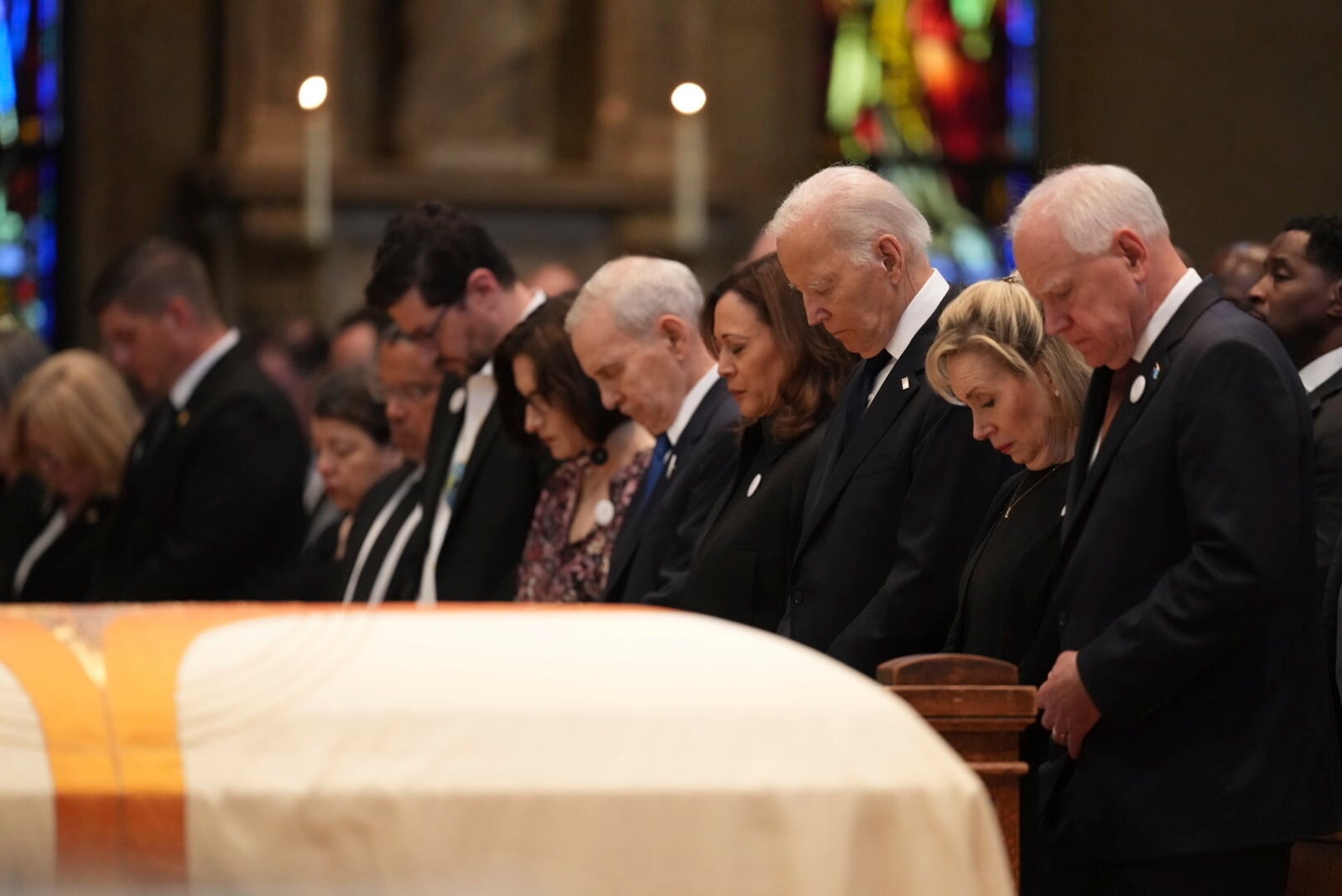 From left, Minnesota attorney general Keith Ellison, Tom Weber, Lt. Gov. Peggy Flanagan, former Minnesota Gov. Mark Dayton, former US Vice President Kamala Harris, former US President Joe Biden, Gwen Walz and Minnesota Gov. Tim Walz attend funeral services for Mark and Melissa Hortman at the Basilica of St. Mary in Minneapolis, Minn., on Saturday, June 28, 2025. (Alex Kormann/Star Tribune via AP, Pool)