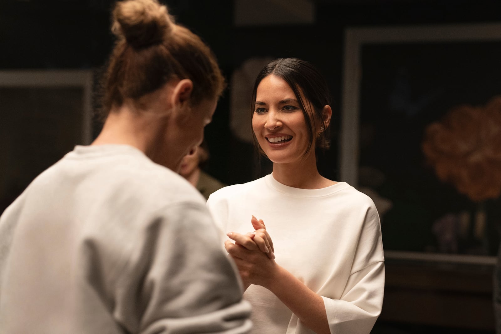 This image released by Apple TV+ shows Amanda Peet, left, and Olivia Munn in a scene from "Your Friends & Neighbors." (Jessica Kourkounis/Apple TV+ via AP)