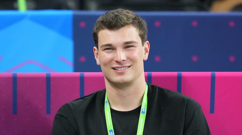 Indiana quarterback Fernando Mendoza (11) watches a drill at the NFL football scouting combine in Indianapolis, Saturday, Feb. 28, 2026. (AP Photo/Julio Cortez)