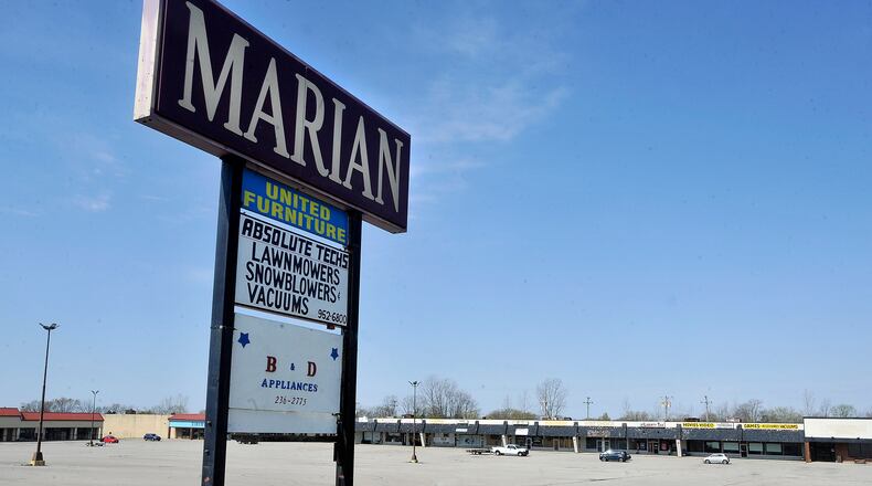 The city of Huber Heights purchased the Marian Shopping Center on Brandt Pike for $2.8 million earlier this year. The city now could purchase additional land behind the shopping center. MARSHALL GORBYSTAFF
