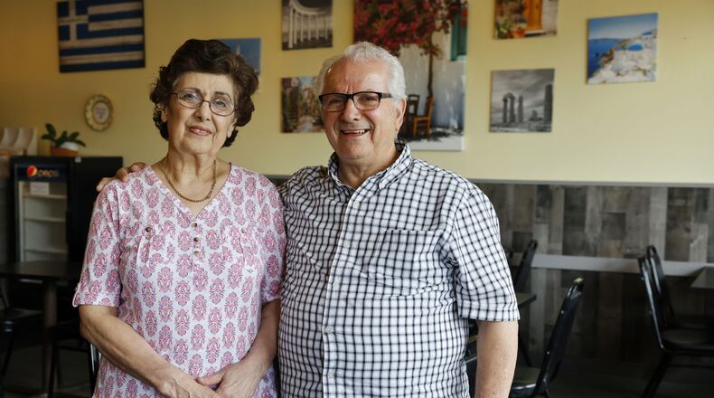 Maria and Dimitri Ververis stand inside their Grecian Delight restaurant in Middletown. NICK GRAHAM/STAFF