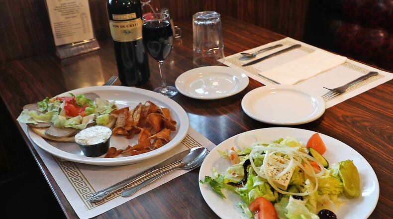 A gyro sandwich and Greek salad at Linardos Villa. BILL LACKEY/STAFF