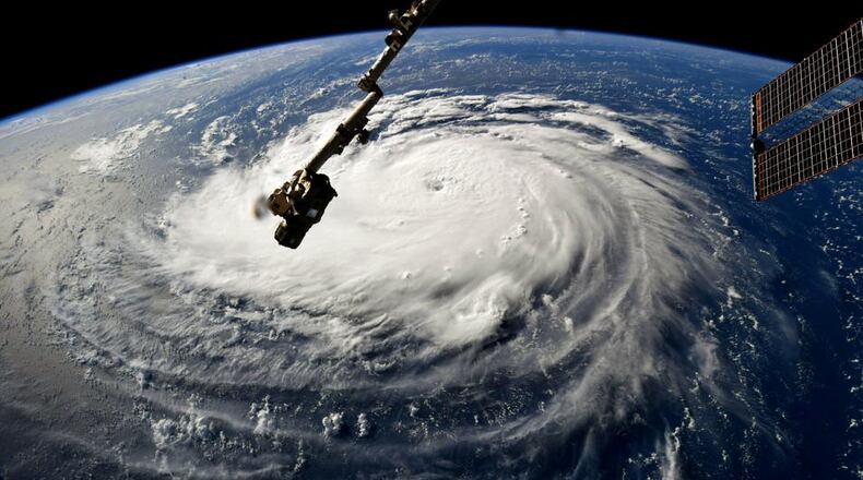 In this NASA handout image taken by Astronaut Ricky Arnold, Hurricane Florence gains strength in the Atlantic Ocean as it moves west, seen from the International Space Station on Monday. (Photo by NASA via Getty Images)
